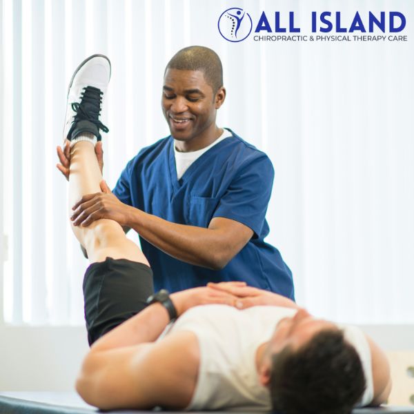 physical therapy bay shore A physical therapist in blue scrubs assists a patient lying on a table by lifting and stretching the patient's leg at All Island Chiropractic & Physical Therapy Care, your trusted choice for Physical Therapy in Bay Shore