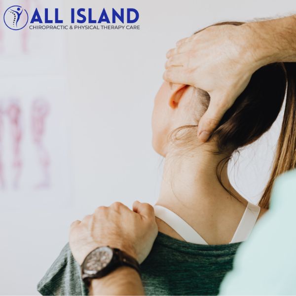 Neck Pain Treatment (1) A chiropractor adjusts a woman's neck while she sits, with the All Island Chiropractic & Physical Therapy Care logo visible in the upper left corner